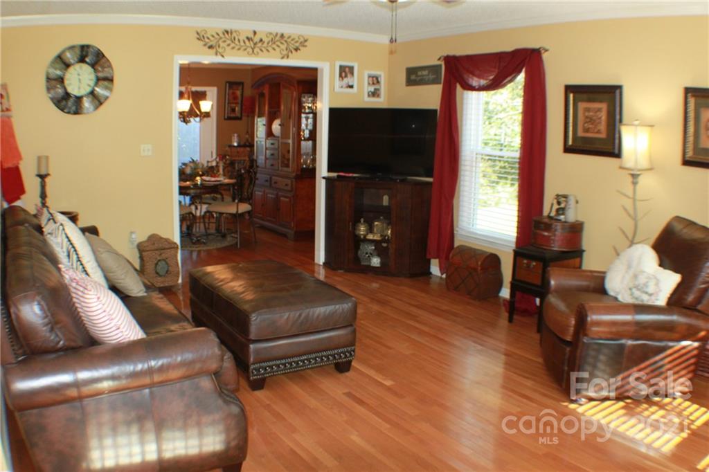 128 Cameron Drive Rutherfordton, NC 28139 - Photo 7 of 48 a living room with furniture and a flat screen tv