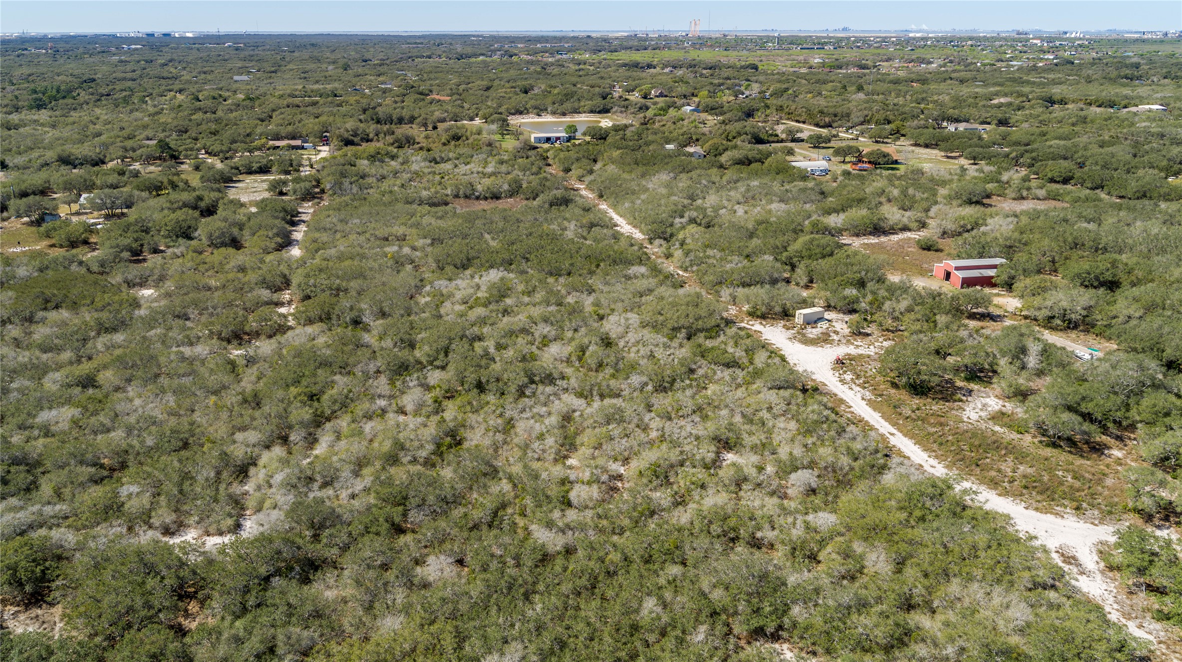 13 Rhodes Avenue Aransas Pass, TX 78336 - Photo 15 of 37 an aerial view of residential houses with outdoor space and trees