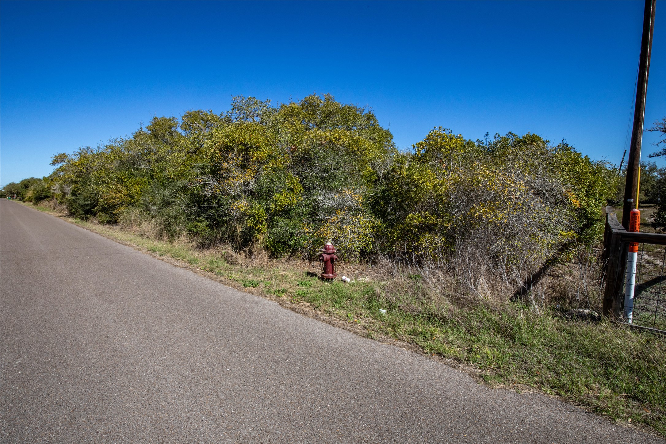 13 Rhodes Avenue Aransas Pass, TX 78336 - Photo 23 of 37 a view of a road from a balcony