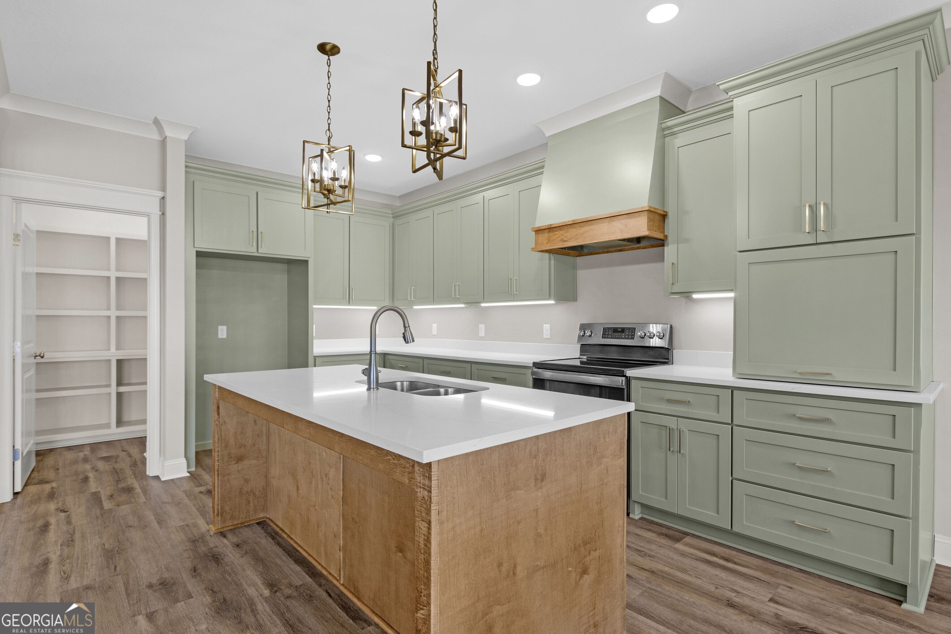 7 Honeysuckle Way Claxton, GA 30417 - Photo 11 of 31 a kitchen with stainless steel appliances granite countertop a sink a stove and a refrigerator