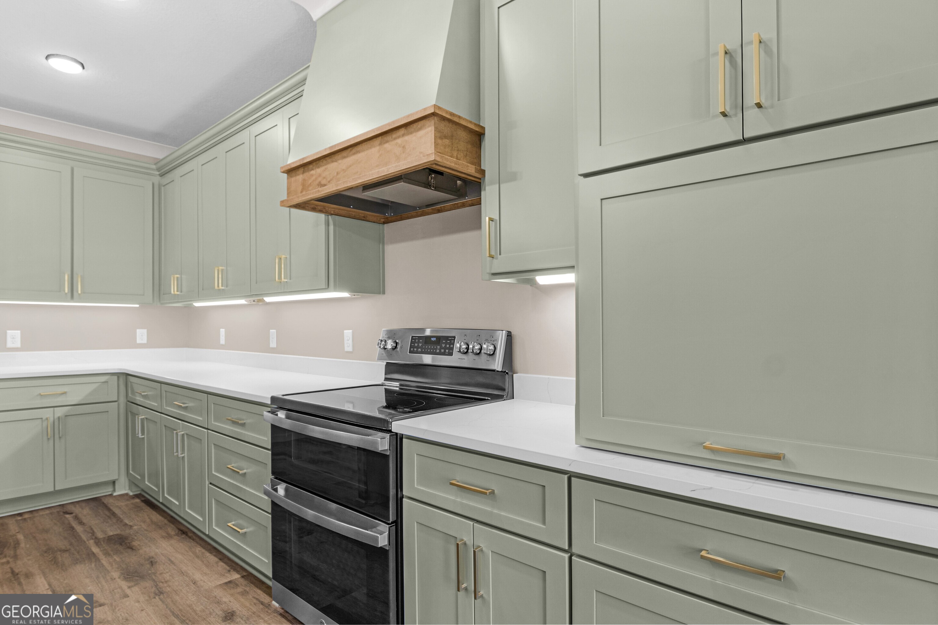 7 Honeysuckle Way Claxton, GA 30417 - Photo 12 of 31 a kitchen with stainless steel appliances white cabinets and a stove