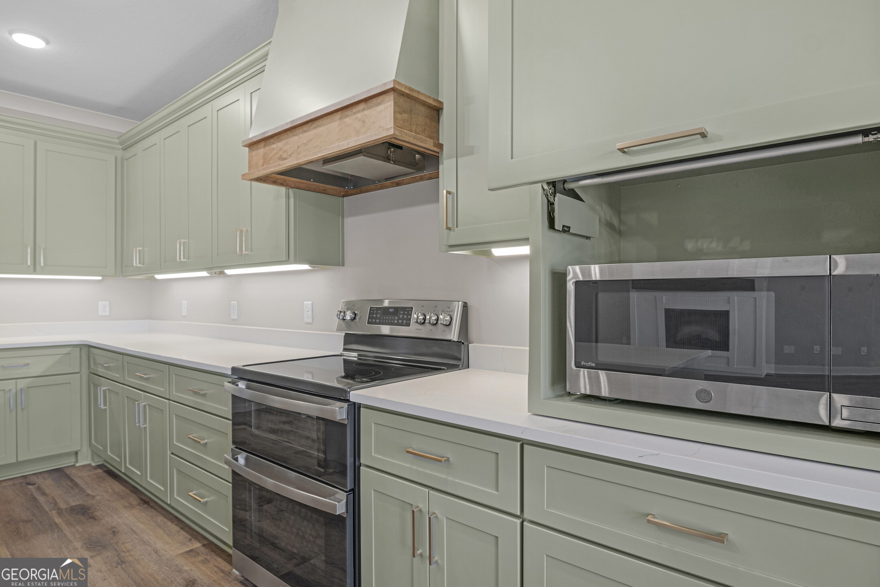 7 Honeysuckle Way Claxton, GA 30417 - Photo 13 of 31 a kitchen with stainless steel appliances granite countertop a sink and a stove
