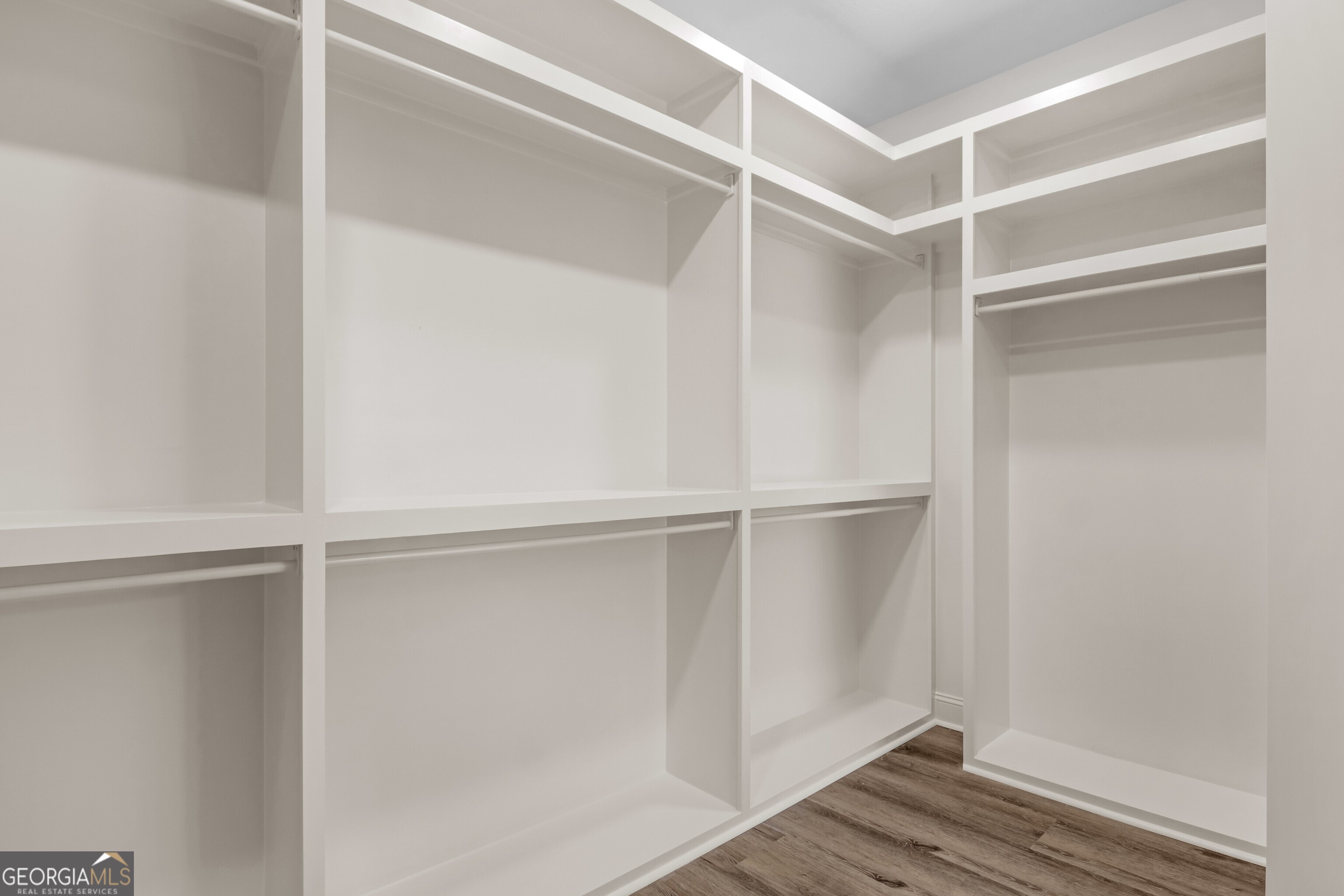 7 Honeysuckle Way Claxton, GA 30417 - Photo 19 of 31 a view of walk in closet with empty racks