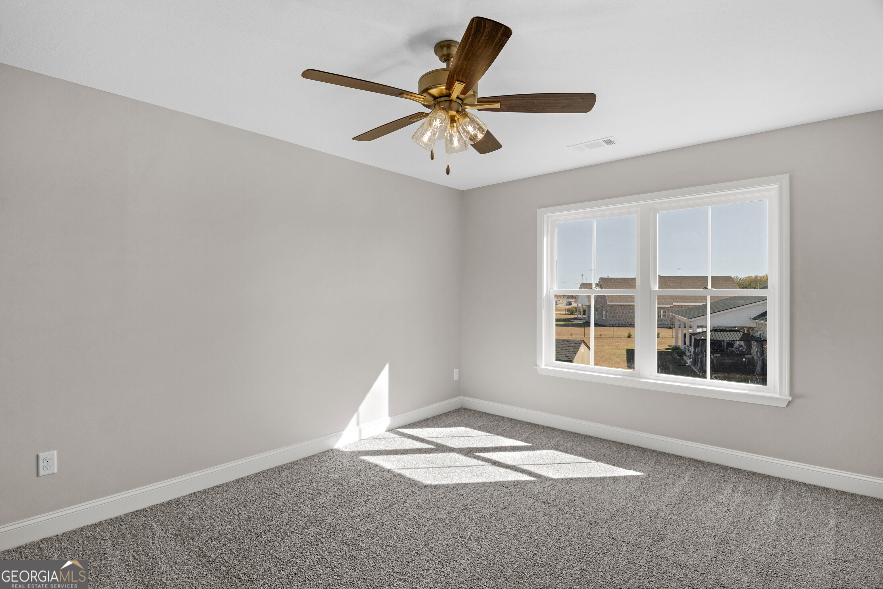 7 Honeysuckle Way Claxton, GA 30417 - Photo 24 of 31 a view of an empty room with a window