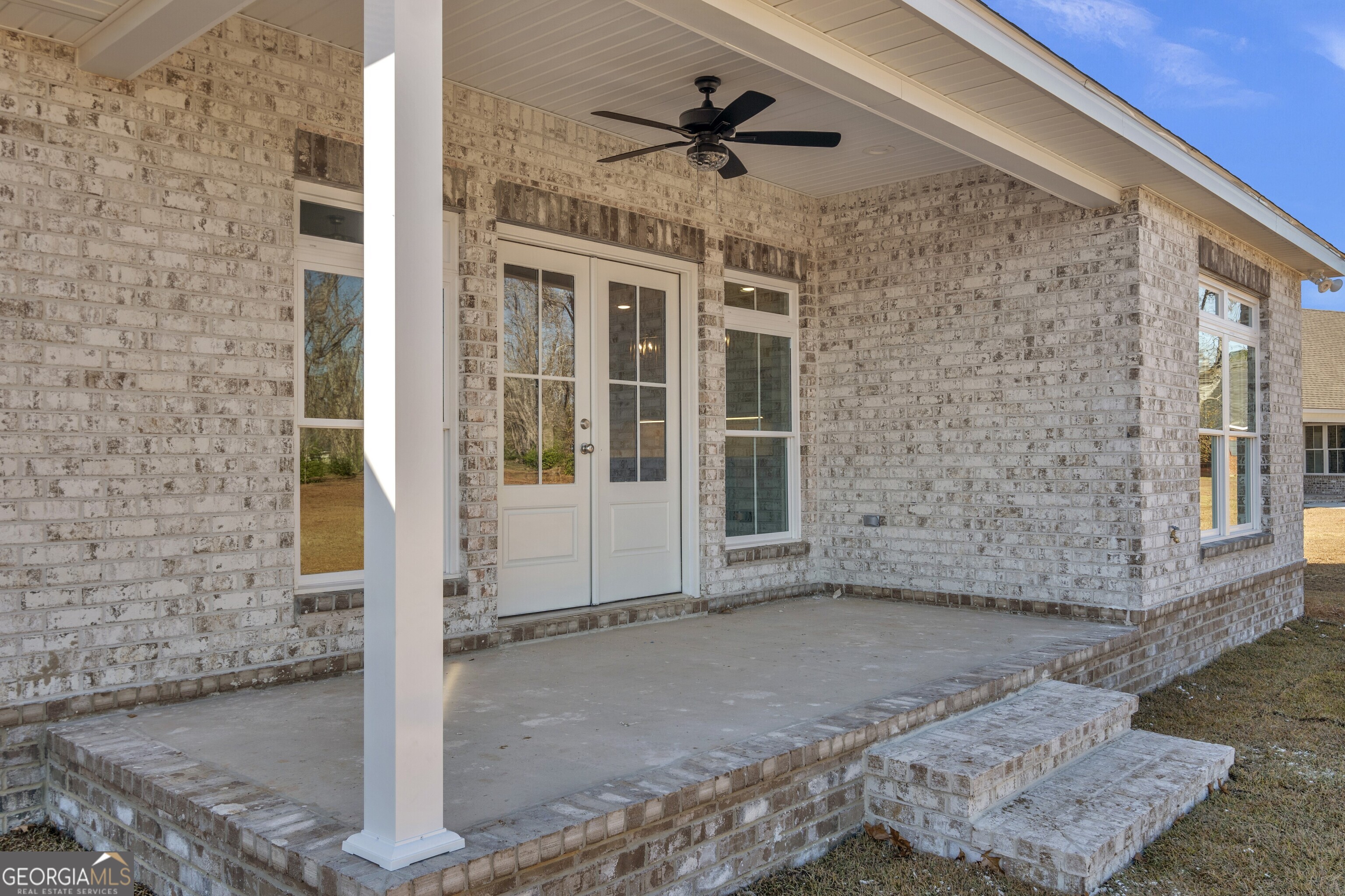 7 Honeysuckle Way Claxton, GA 30417 - Photo 29 of 31 a view of a porch with a table and chairs