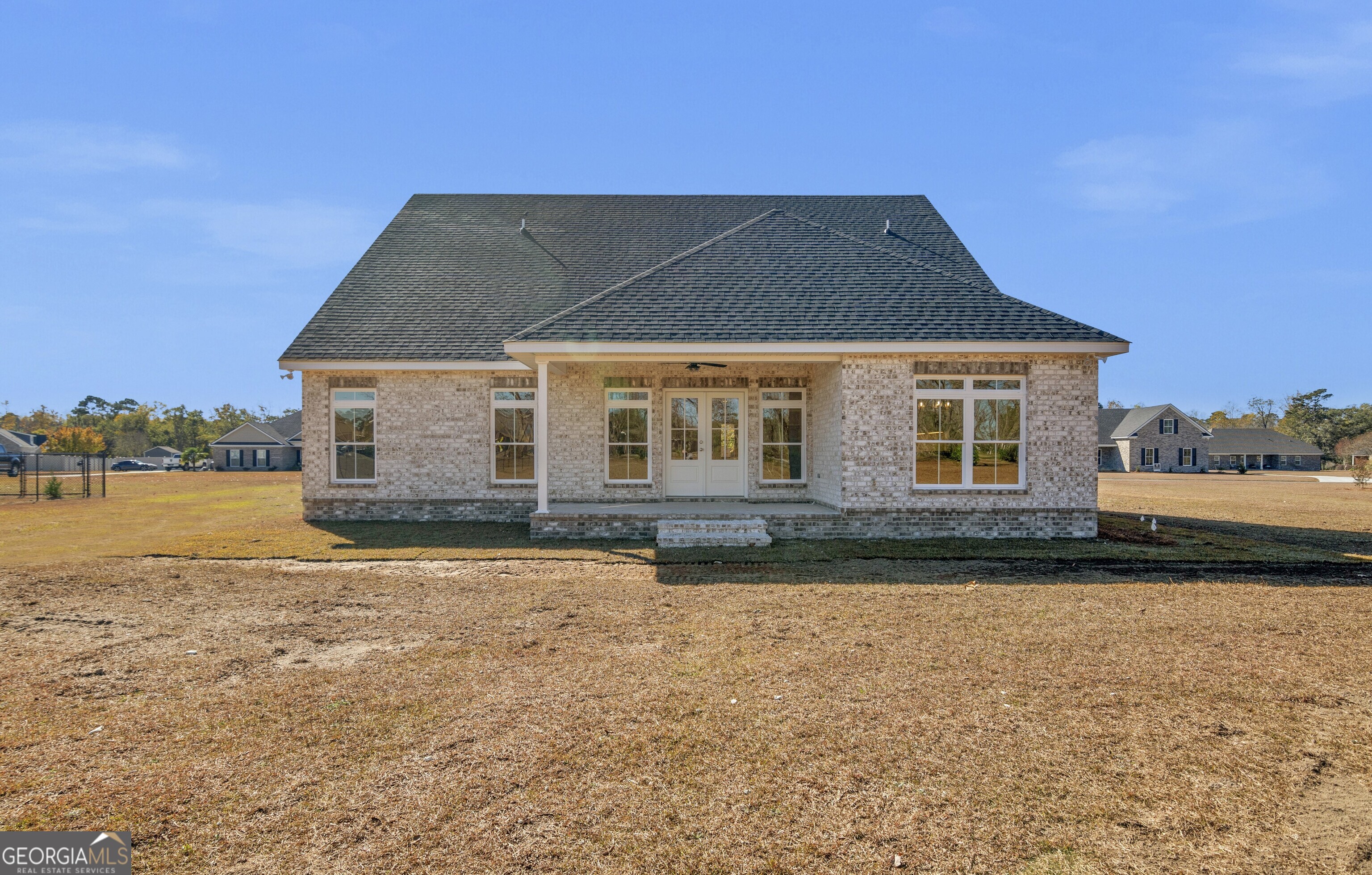 7 Honeysuckle Way Claxton, GA 30417 - Photo 30 of 31 a front view of a house with a yard