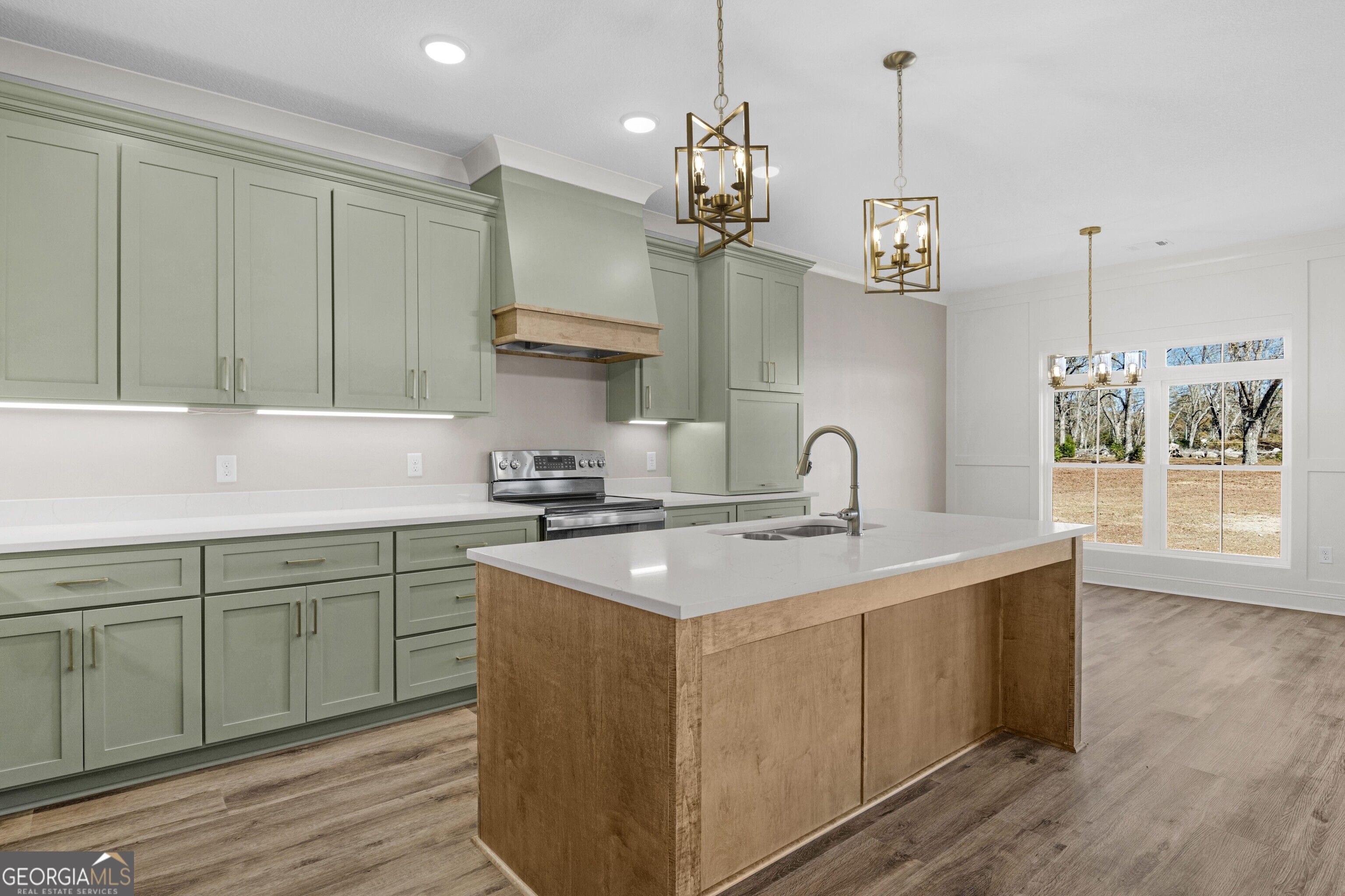 7 Honeysuckle Way Claxton, GA 30417 - Photo 8 of 31 a kitchen with cabinets a sink and appliances