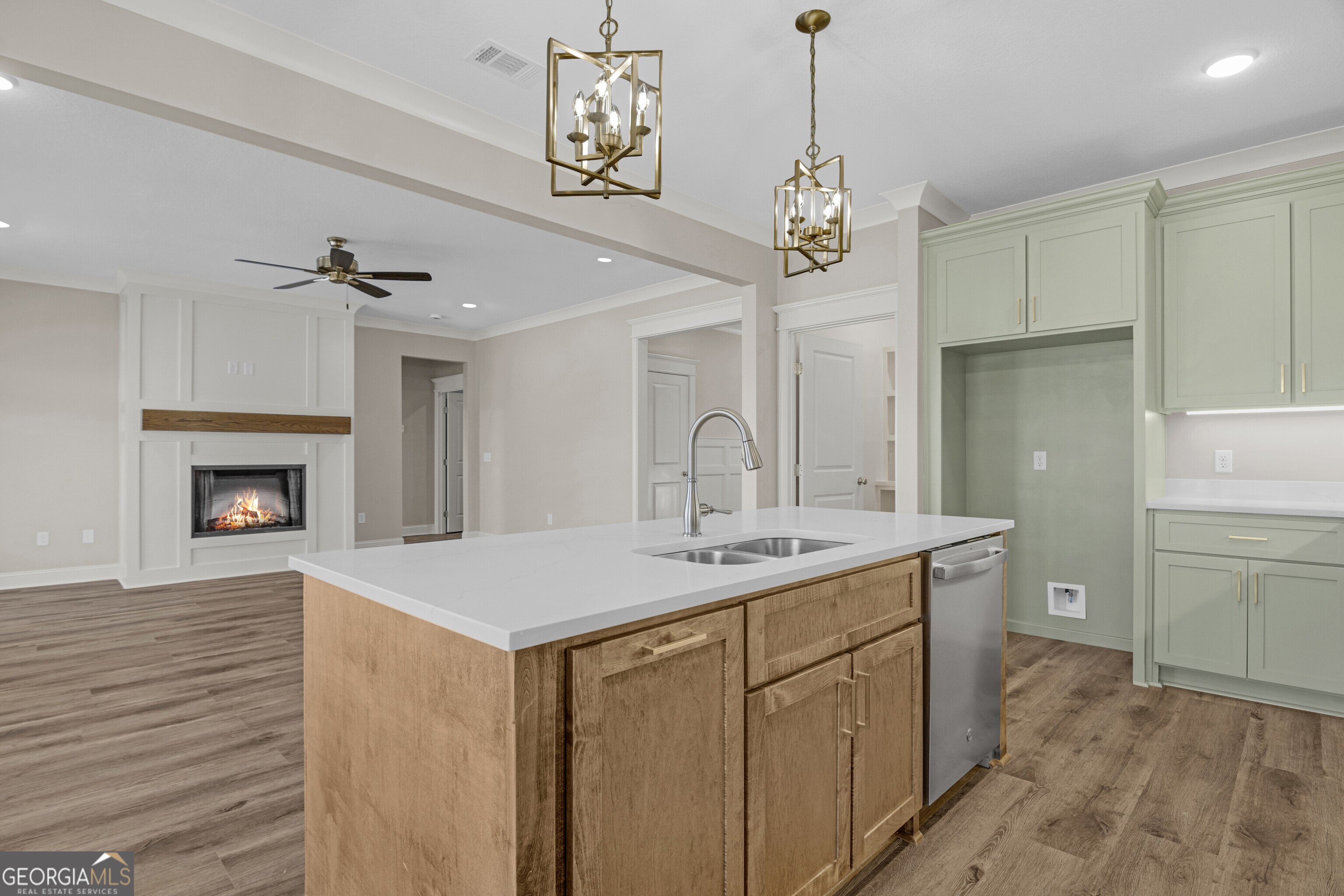 7 Honeysuckle Way Claxton, GA 30417 - Photo 9 of 31 a view of a kitchen sink and dishwasher with wooden floor