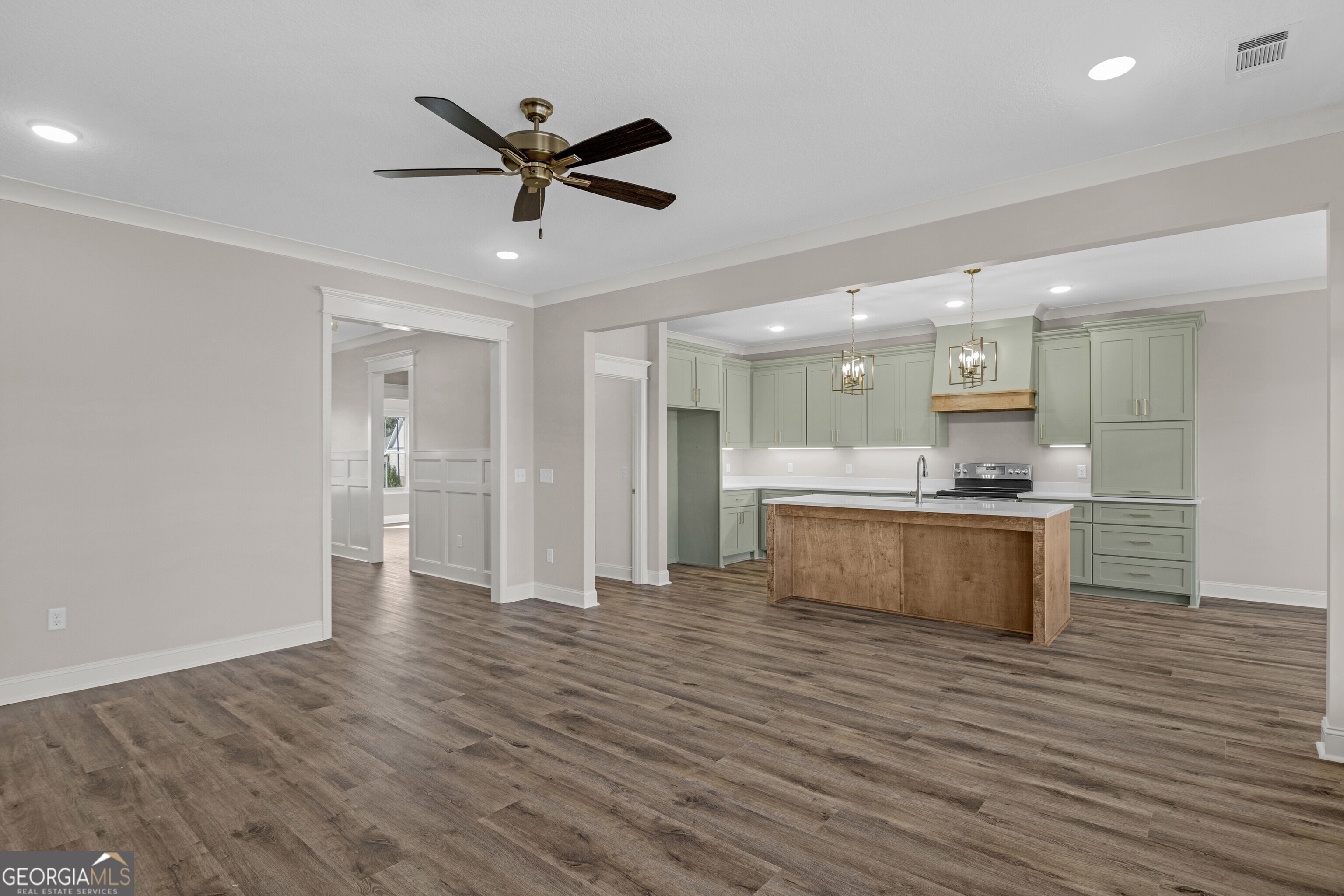 7 Honeysuckle Way Claxton, GA 30417 - Photo 10 of 31 a large kitchen with a refrigerator and wooden floor