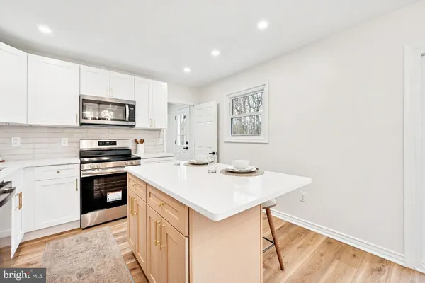a kitchen with a stove and a sink