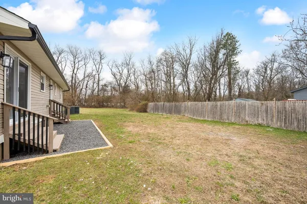 a view of outdoor space with deck and tree