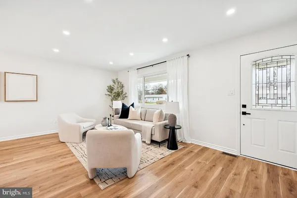 a room with furniture and wooden floor