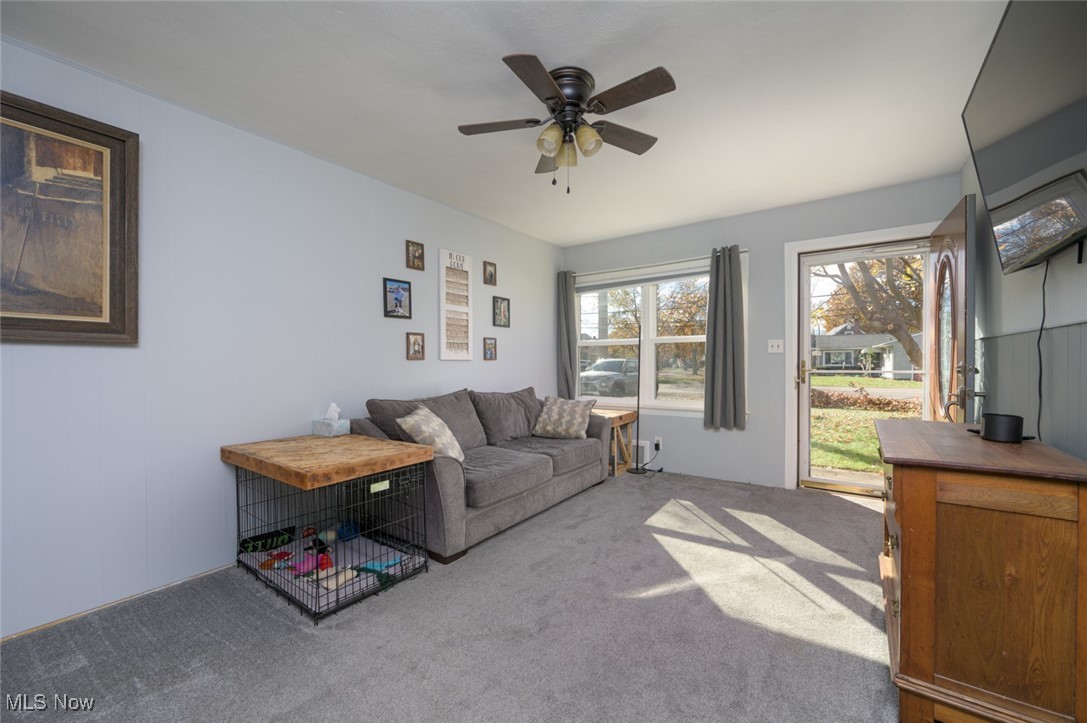 2547 Mogadore Road Akron, OH 44312 - Photo 6 of 31 Carpeted living room with ceiling fan