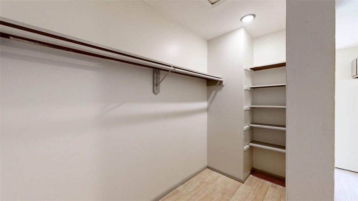 725 Peppertree Drive, Unit 26 Bryan, TX 77801 - Photo 8 of 14 Walk in closet featuring light wood finished floors