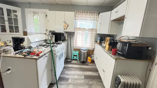 a storage room with a window and washer