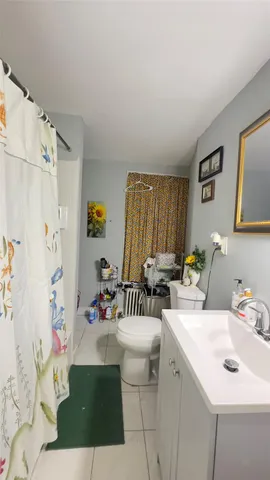 a bathroom with a sink a mirror and a bathtub