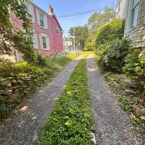a view of a building with a yard