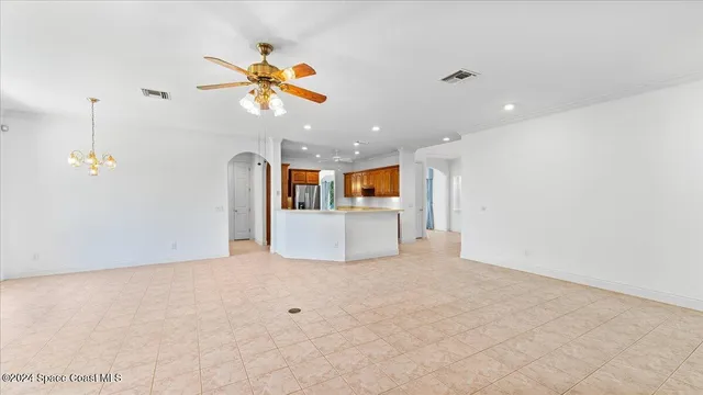 a bathroom with a tub a sink and a large mirror