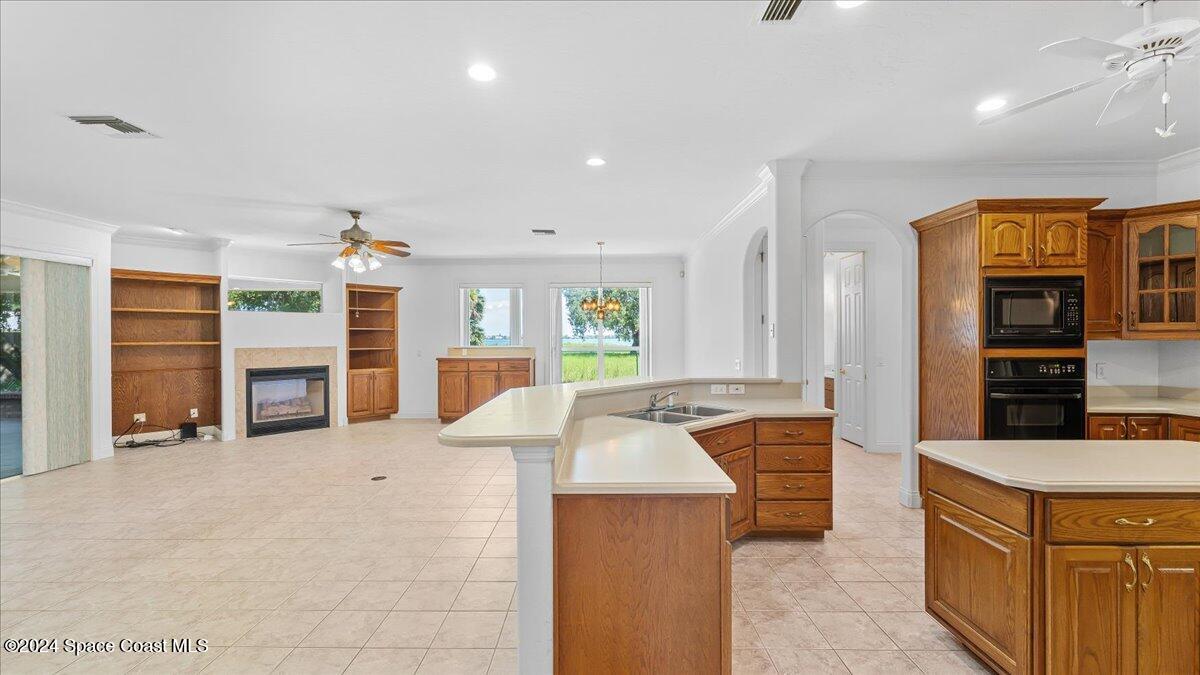 9140 South Tropical Trail Merritt Island, FL 32952 - Photo 19 of 68 a large white kitchen with a large window