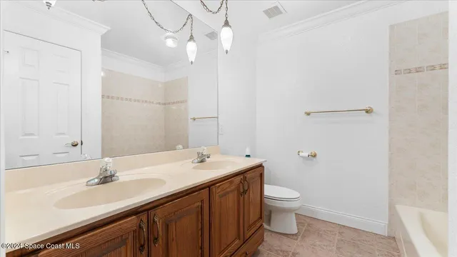 a bathroom with a sink a vanity and a mirror
