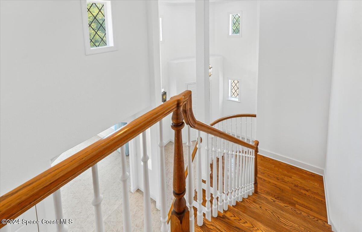 9140 South Tropical Trail Merritt Island, FL 32952 - Photo 42 of 68 a view of staircase with railing and white walls