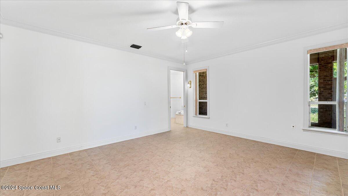 9140 South Tropical Trail Merritt Island, FL 32952 - Photo 43 of 68 a view of an empty room with a window
