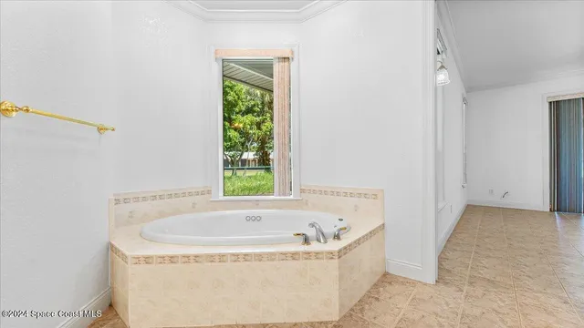 a view of a lake with a table and chairs