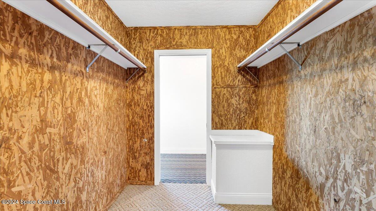 9140 South Tropical Trail Merritt Island, FL 32952 - Photo 56 of 68 a bathroom with a shower and a toilet