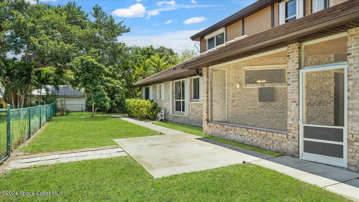 9140 South Tropical Trail Merritt Island, FL 32952 - Photo 8 of 68 a view of backyard with a garden and plants