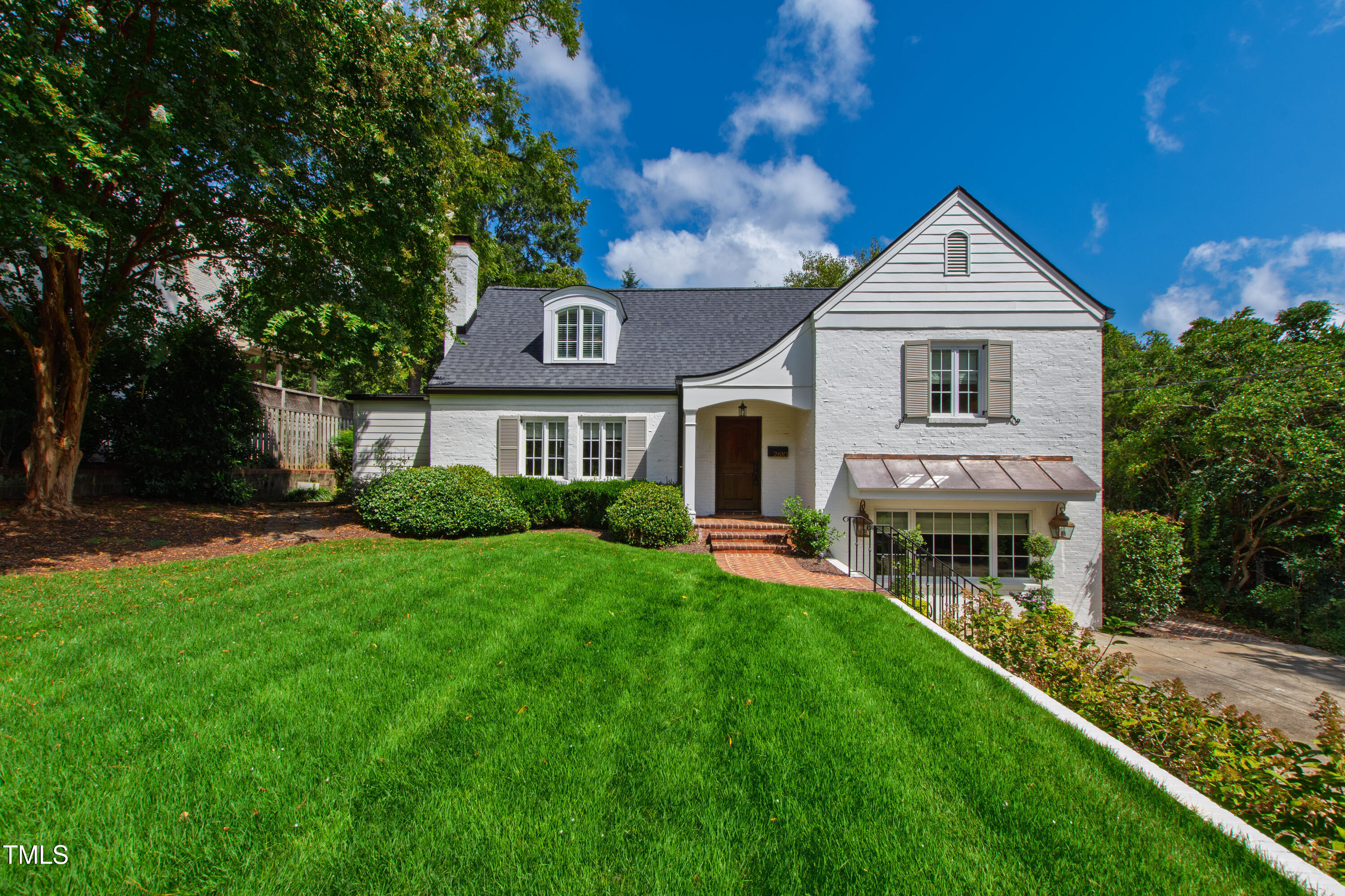 2610 Wells Avenue Raleigh, NC 27608 - Photo 1 of 64 a front view of a house with a yard