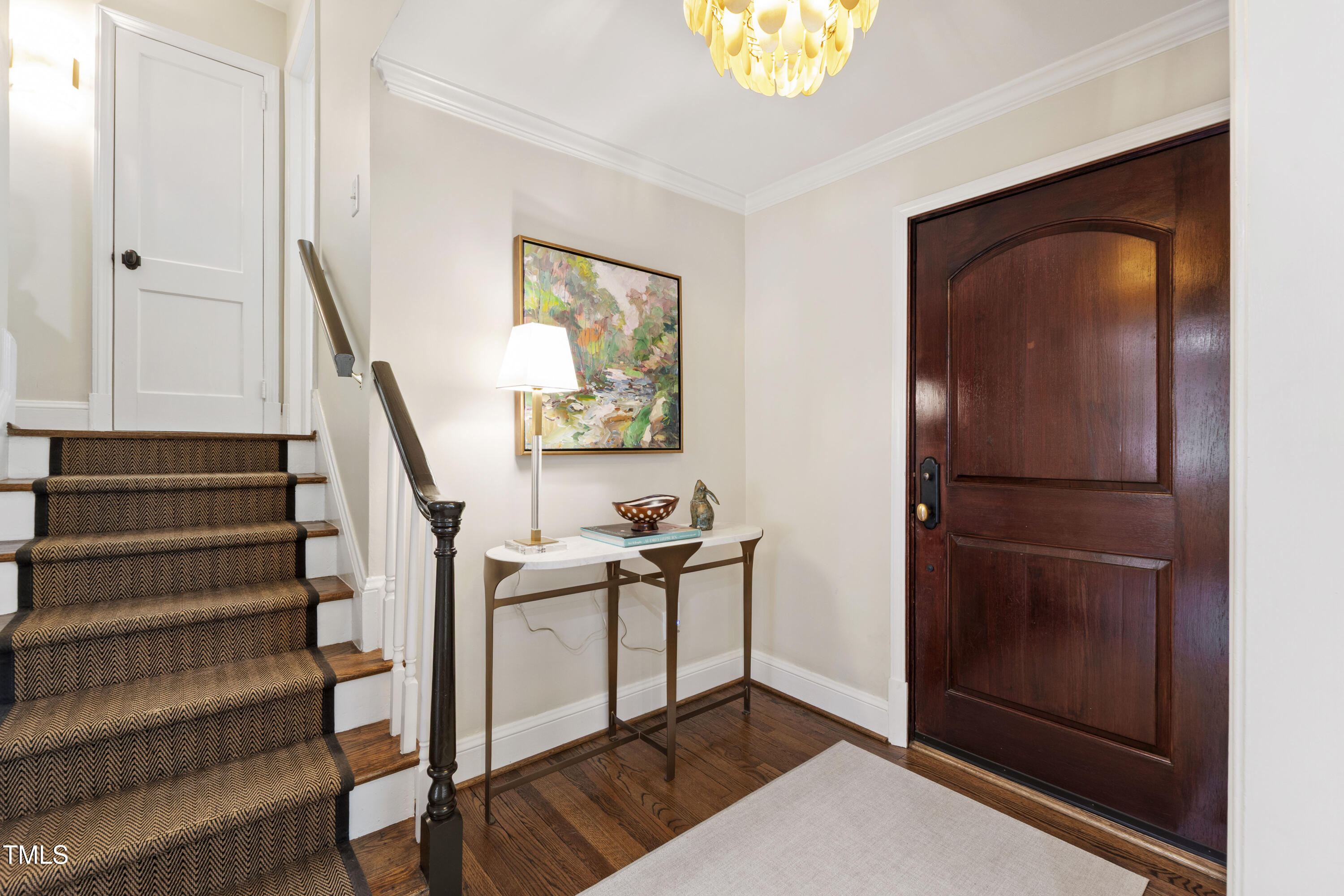 2610 Wells Avenue Raleigh, NC 27608 - Photo 4 of 64 a view of hallway with stairs and wooden floor