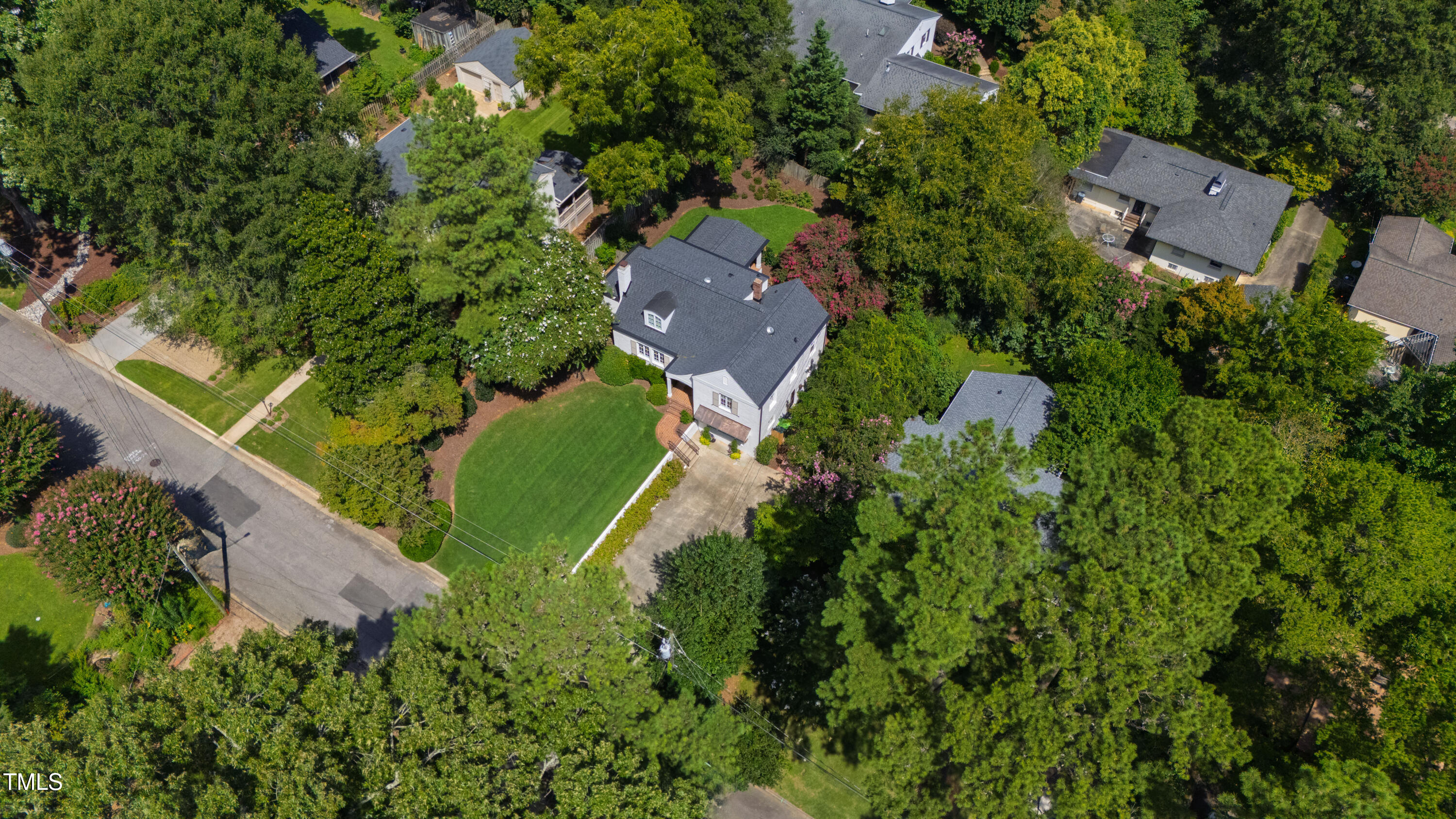 2610 Wells Avenue Raleigh, NC 27608 - Photo 61 of 64 an aerial view of a house with a yard