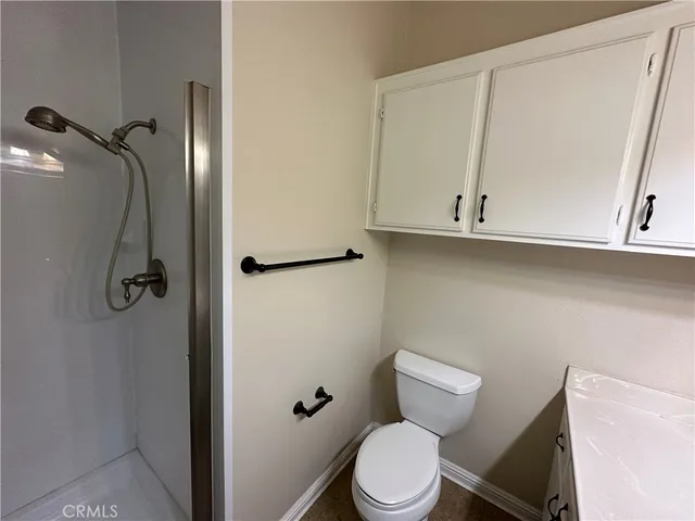 a kitchen with granite countertop a stove and a sink