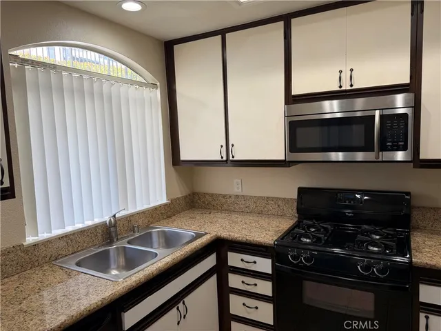 a kitchen with a stove and a microwave