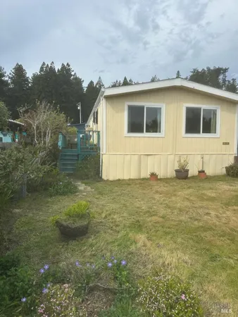 a house that has swimming pool in front of it