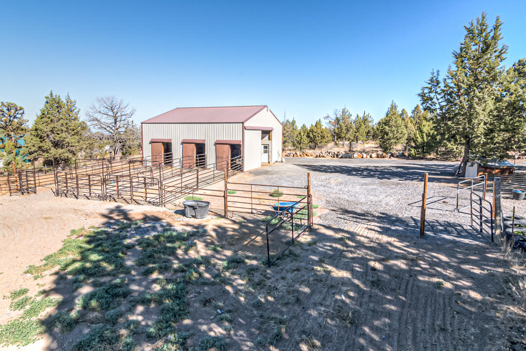 14555 Southeast Crow Road Prineville, OR 97754 - Photo 3 of 29 36X36 barn with 3 stalls & runs, tack room and space enough for 5 tons of hay