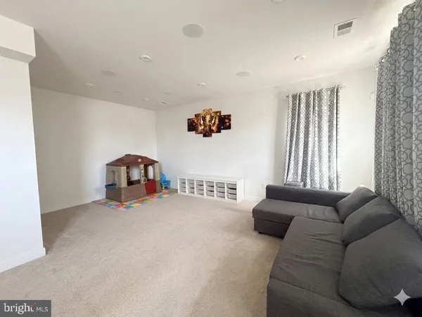 a view of a livingroom with furniture and a couch