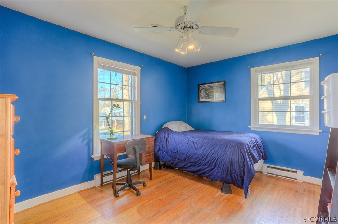 4716 Wedgemere Road Chesterfield, VA 23832 - Photo 11 of 18 a bedroom with a bed and a chair