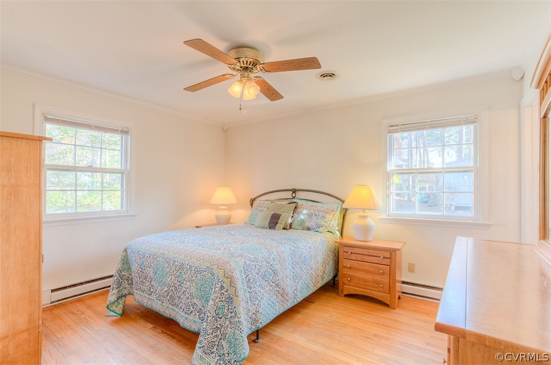 4716 Wedgemere Road Chesterfield, VA 23832 - Photo 12 of 18 a bedroom with a bed a dresser and a window