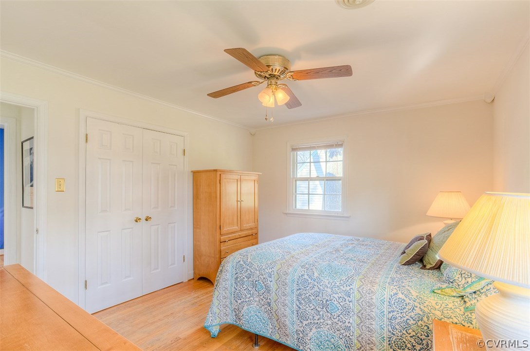 4716 Wedgemere Road Chesterfield, VA 23832 - Photo 13 of 18 a bedroom with a bed and a chandelier fan