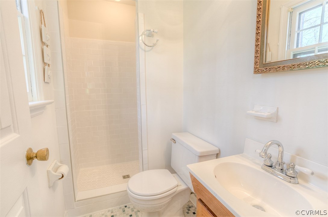 4716 Wedgemere Road Chesterfield, VA 23832 - Photo 14 of 18 a bathroom with a sink toilet and shower