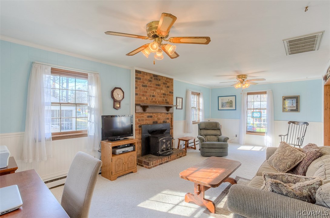 4716 Wedgemere Road Chesterfield, VA 23832 - Photo 6 of 18 a living room with furniture a fireplace and a flat screen tv