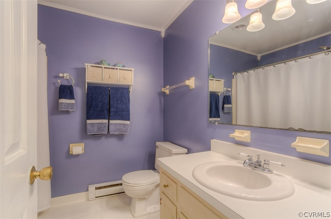 4716 Wedgemere Road Chesterfield, VA 23832 - Photo 9 of 18 a bathroom with a sink a toilet and mirror