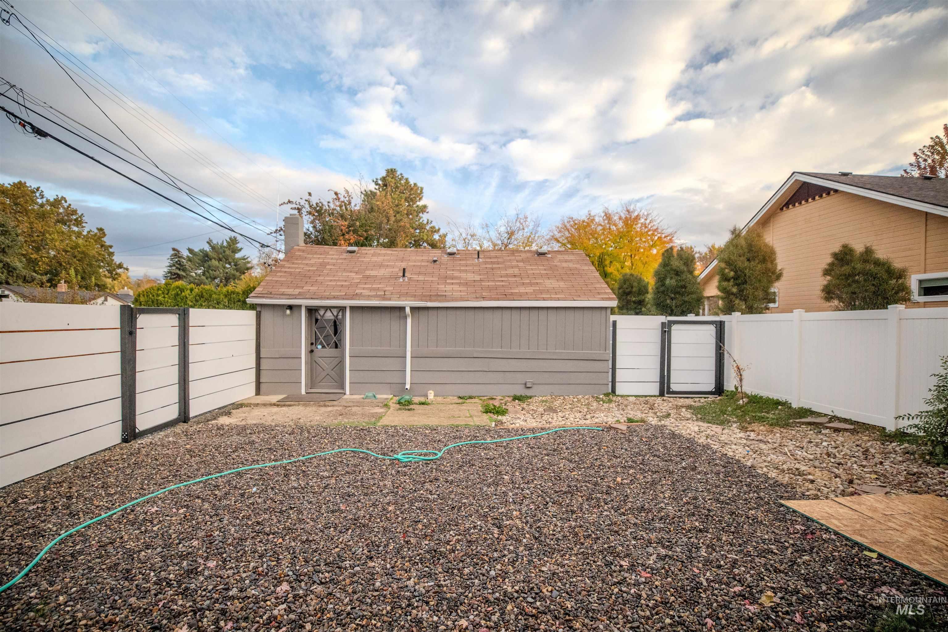 3311 Hamilton Street Boise, ID 83705 - Photo 20 of 31 Fenced backyard featuring a gate and storage shed
