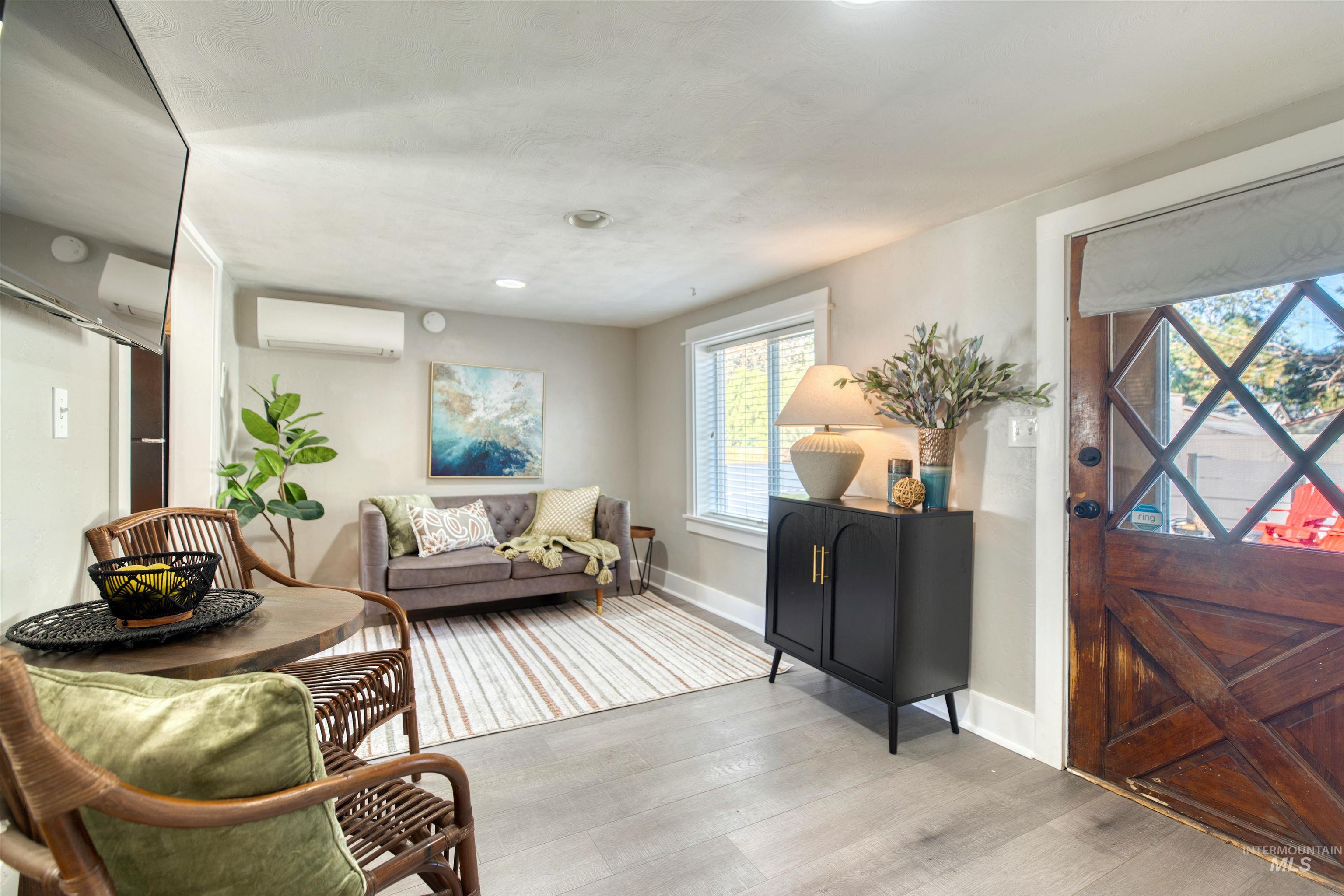 3311 Hamilton Street Boise, ID 83705 - Photo 6 of 31 Foyer entrance with wood finished floors and a wall mounted AC