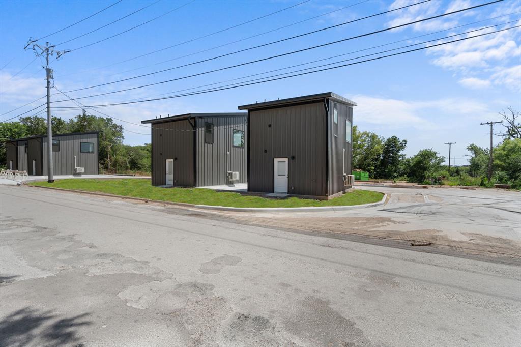 802 Old Wise Road, Unit 23 Bowie, TX 76230 - Photo 2 of 22 a view of a house with a yard and plants