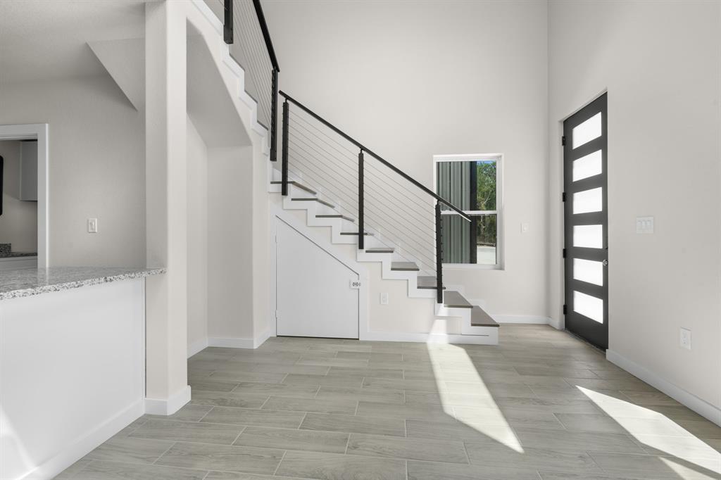 802 Old Wise Road, Unit 23 Bowie, TX 76230 - Photo 10 of 22 a view of entryway and hall with wooden floor