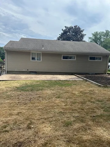 a view of house with yard