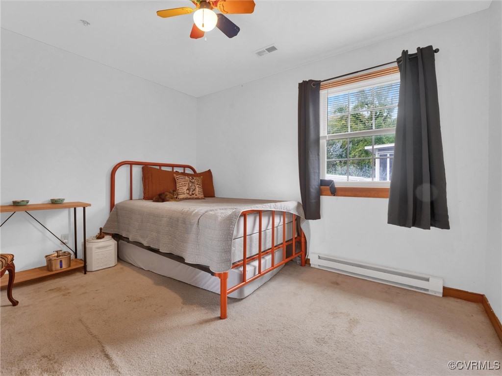 16236 Mistora Road Chester, VA 23831 - Photo 3 of 9 a bedroom with a bed and window