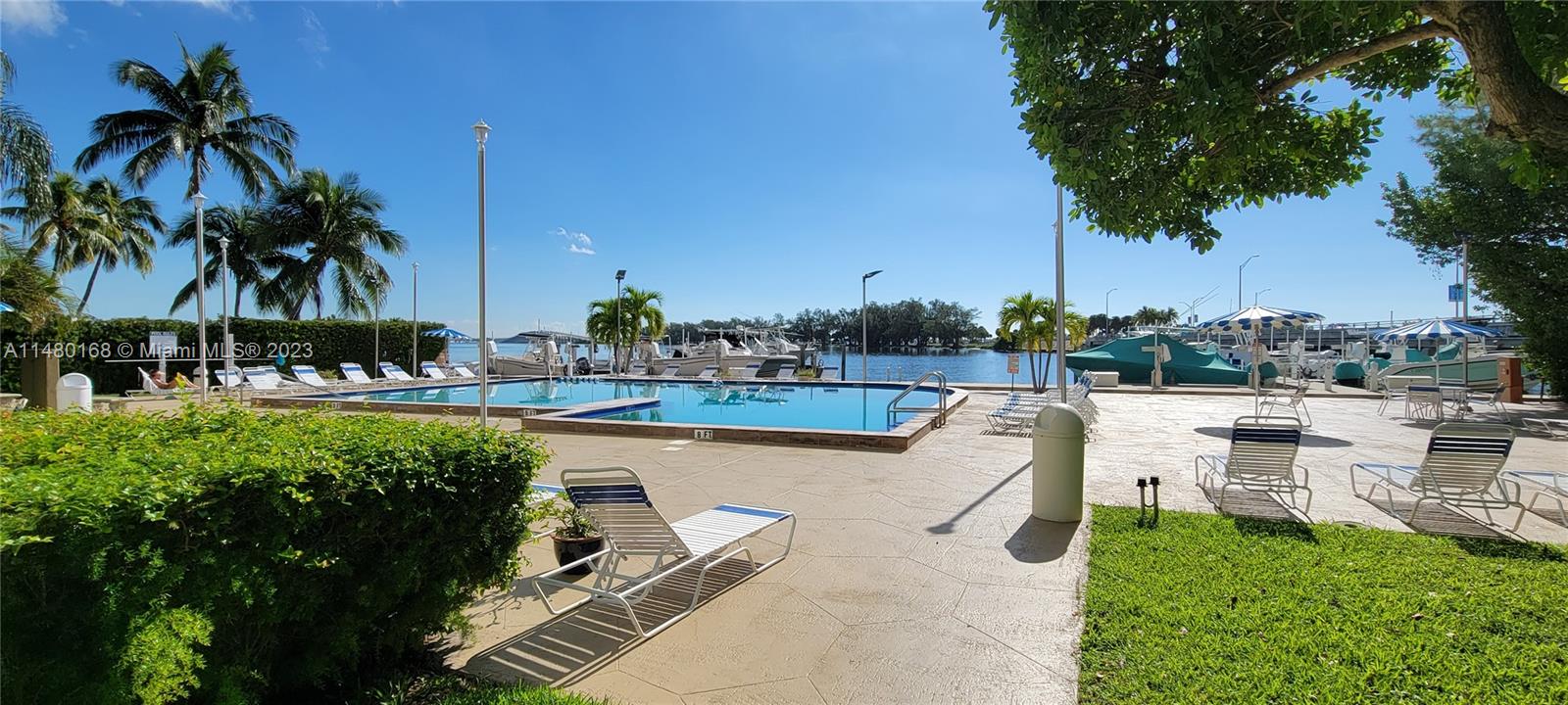 Brickell Biscayne Condominiums Miami, FL 33129 - Photo 3 of 12 a view of a swimming pool and lounge chairs